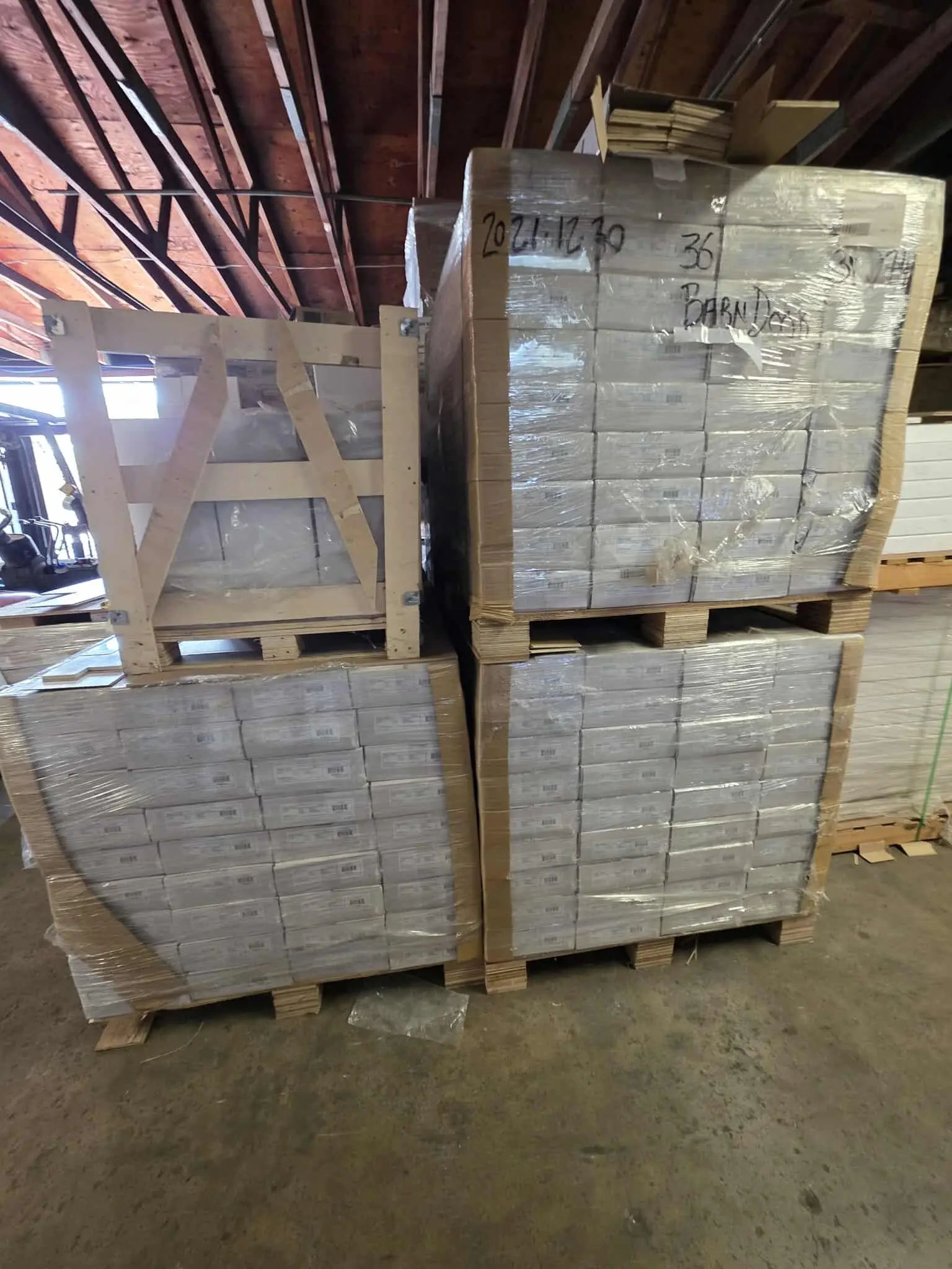 A photo of pallets of Barn Door flooring