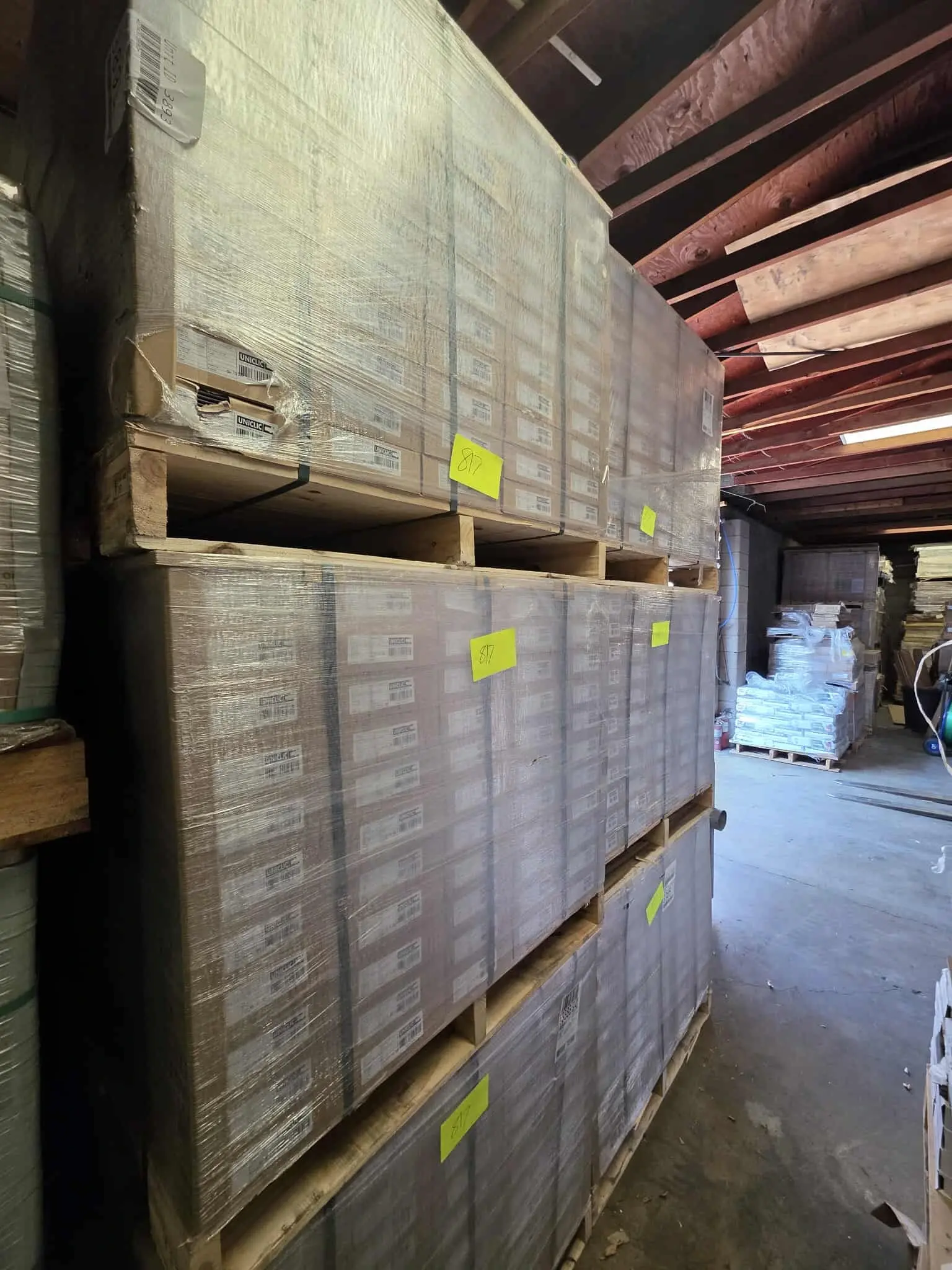 A photo of pallets of Uniclic flooring
