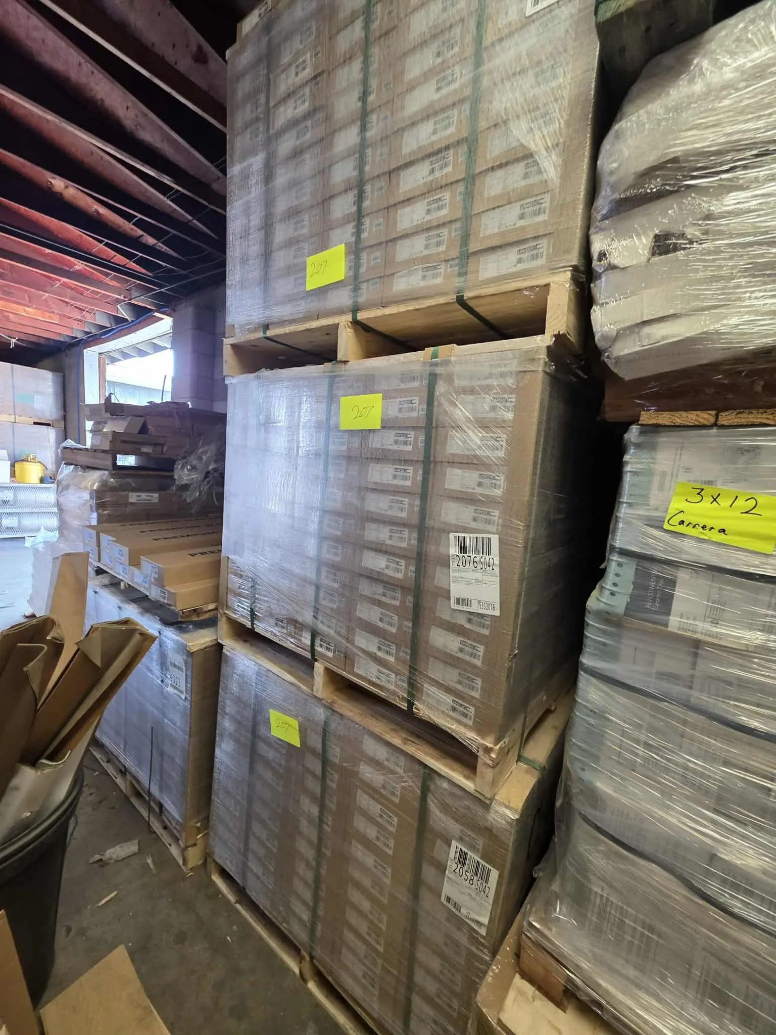 A photo of several pallets of closeout flooring