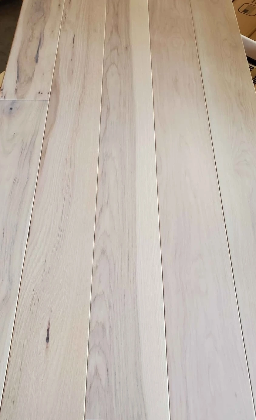 A photo of Light grey prefinished engineered Hickory hardwood flooring