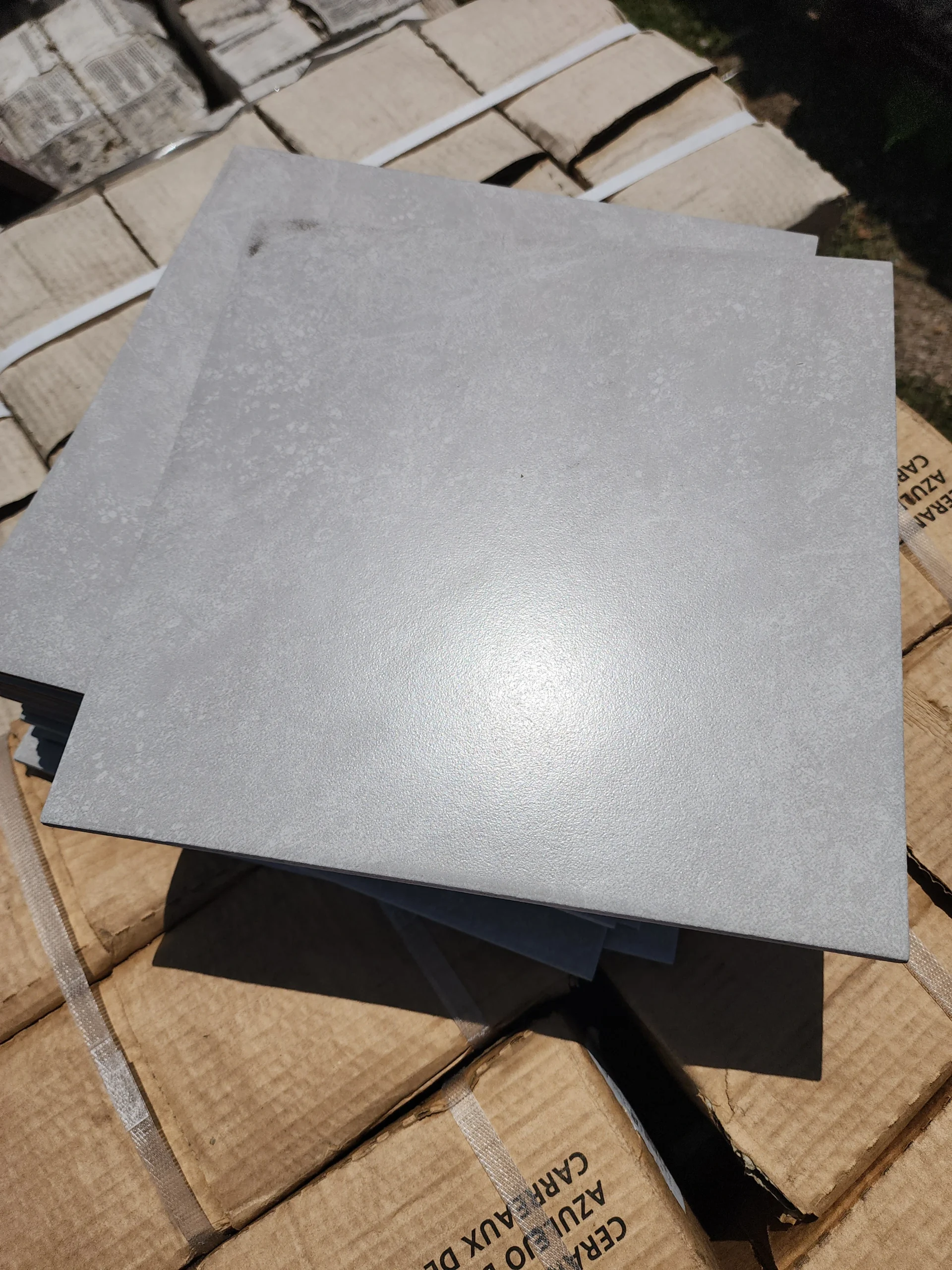 A photo of Another grey 24 x 24 tile